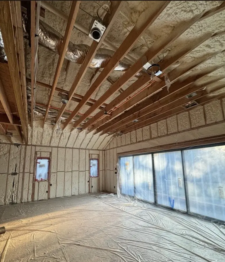 Interior walls and ceiling insulated with spray foam during new construction in Waipio Acres